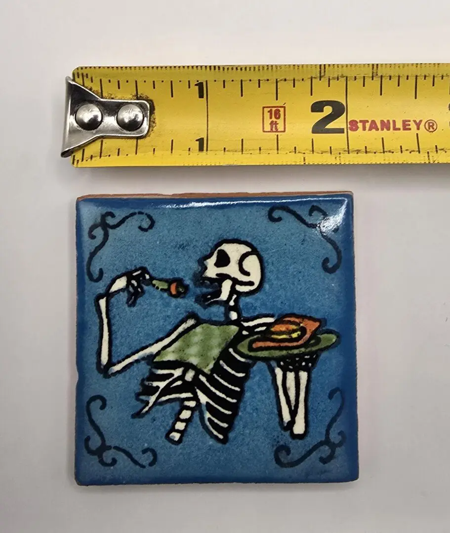 Skeleton eating with tape measure above.