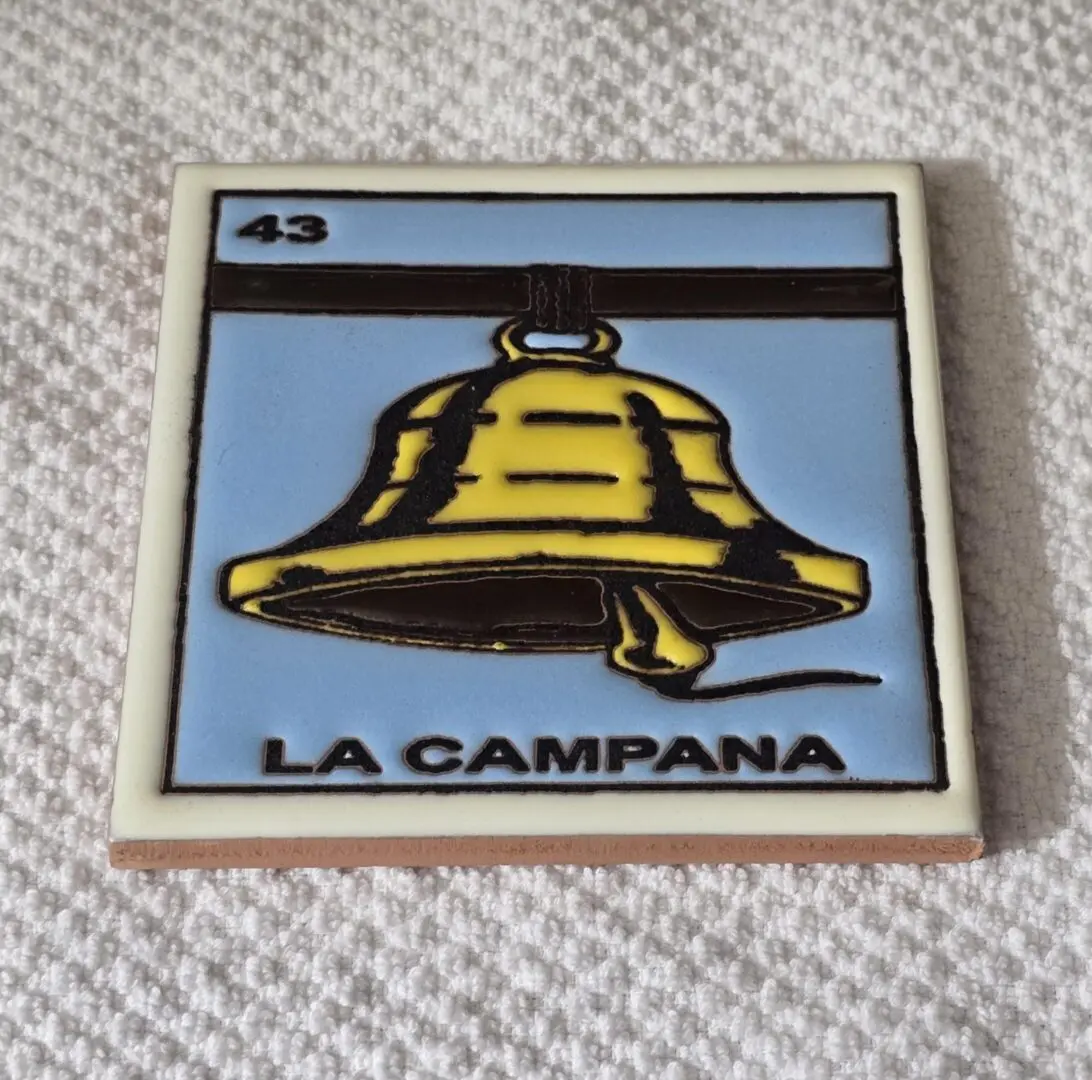 Tile with a bell and "La Campana".