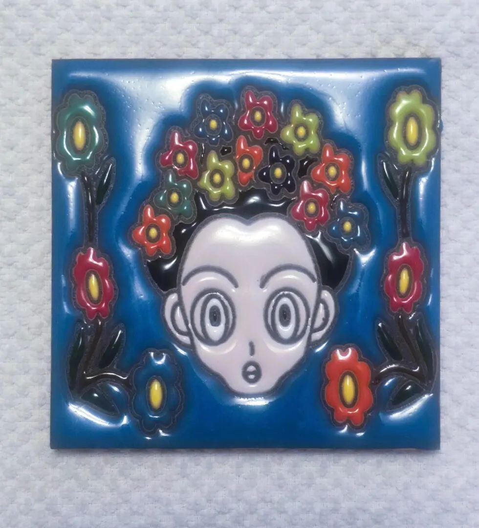 Colorful cartoon face surrounded by flowers.