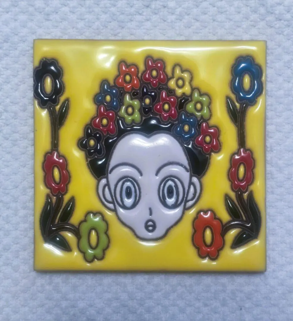 Cartoon face with colorful flower crown design.