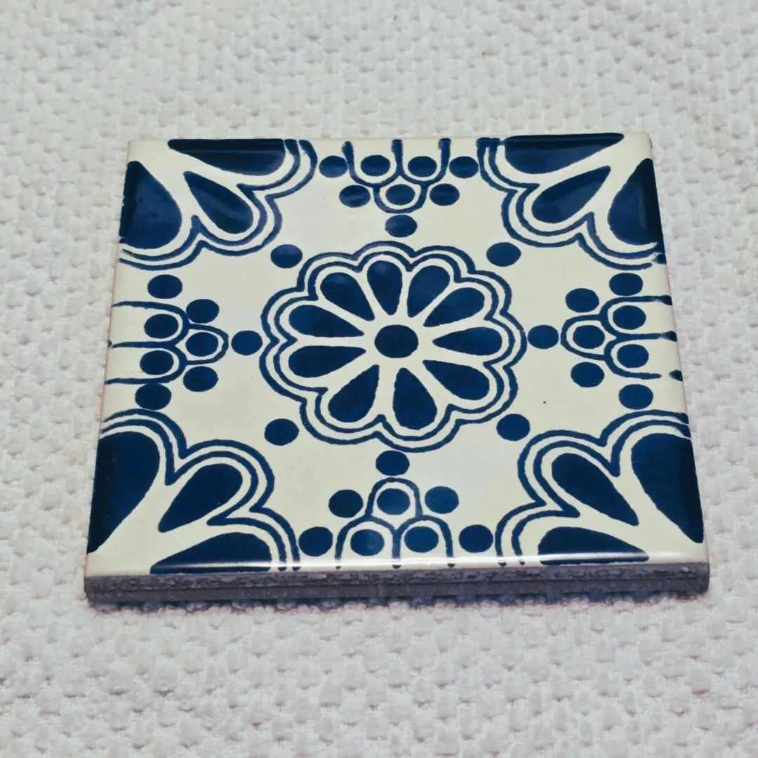 Blue and white ornamental ceramic tile