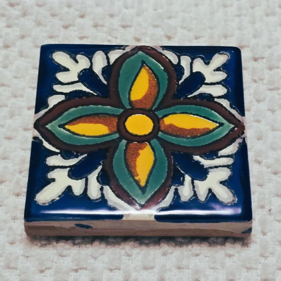 Colorful hand-painted ceramic tile with flower