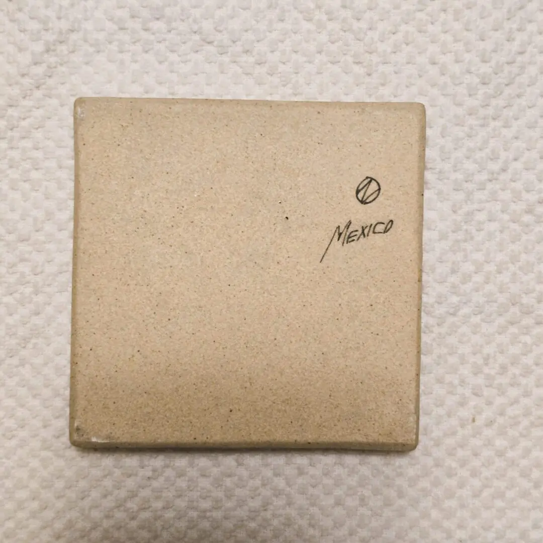 A closed beige box with the word 'Moser' on it.