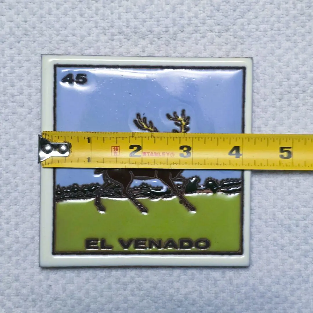 LoterÃa card with measuring tape on top.