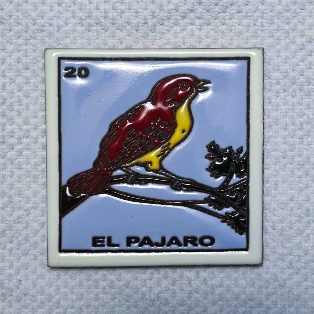 Bird illustration with "El Pajaro" text.