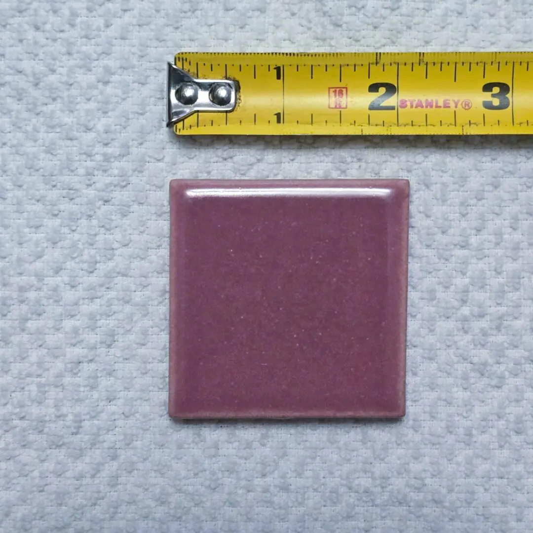 Purple tile with measuring tape above.