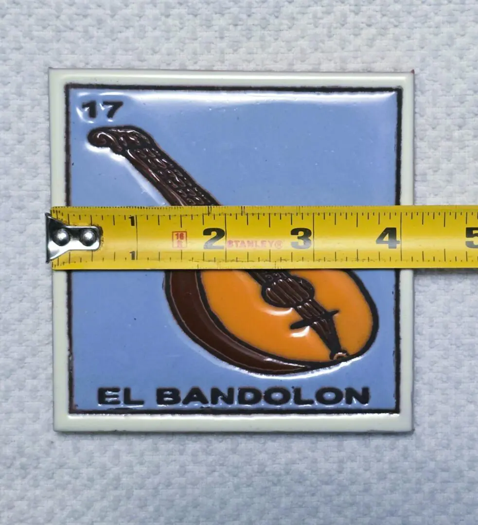 Tile with bandolon and measuring tape.