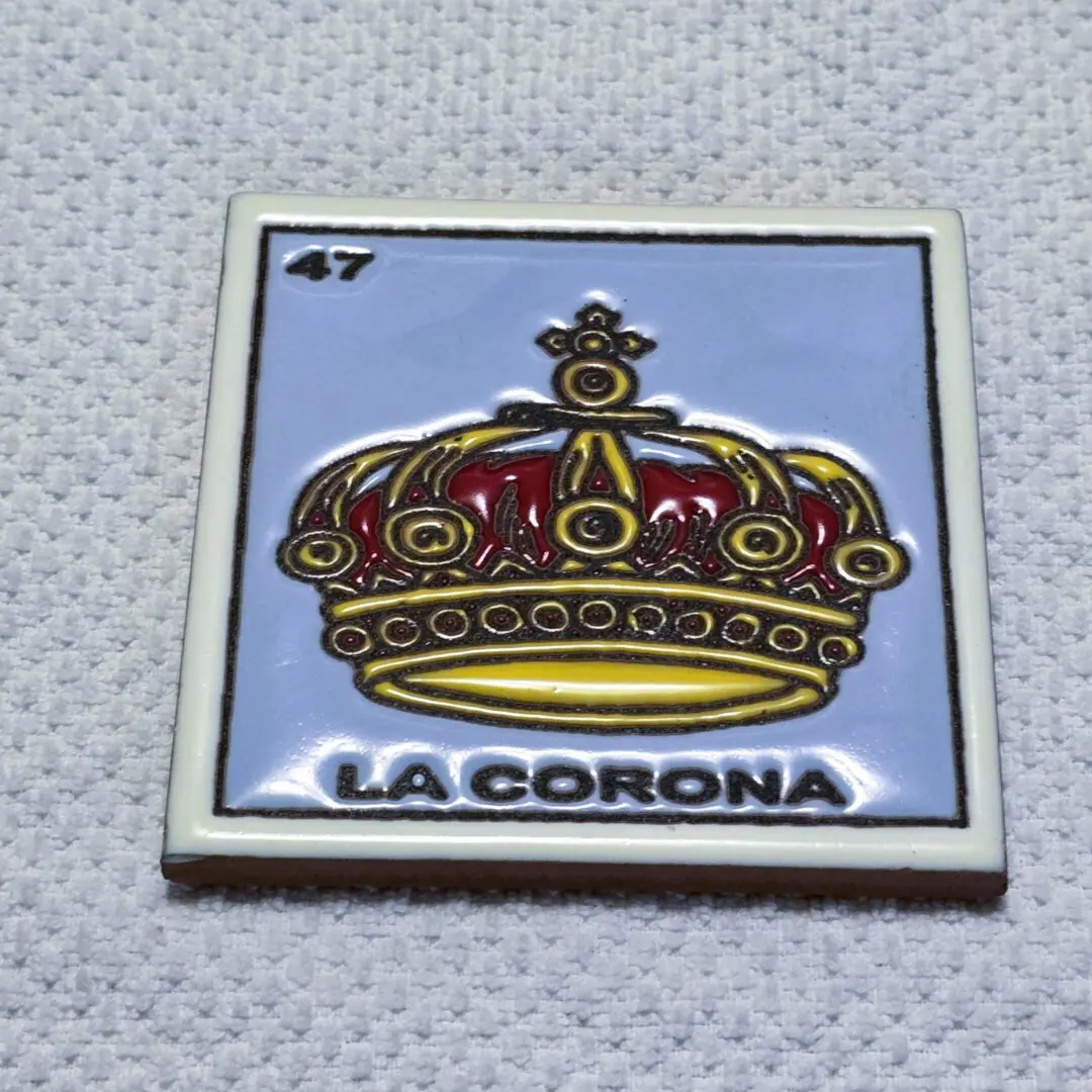 Tile with crown labeled "La Corona", number 47.