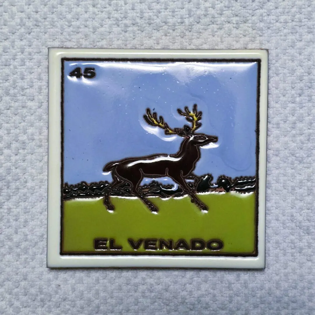 Tile with deer illustration, labeled "El Venado".