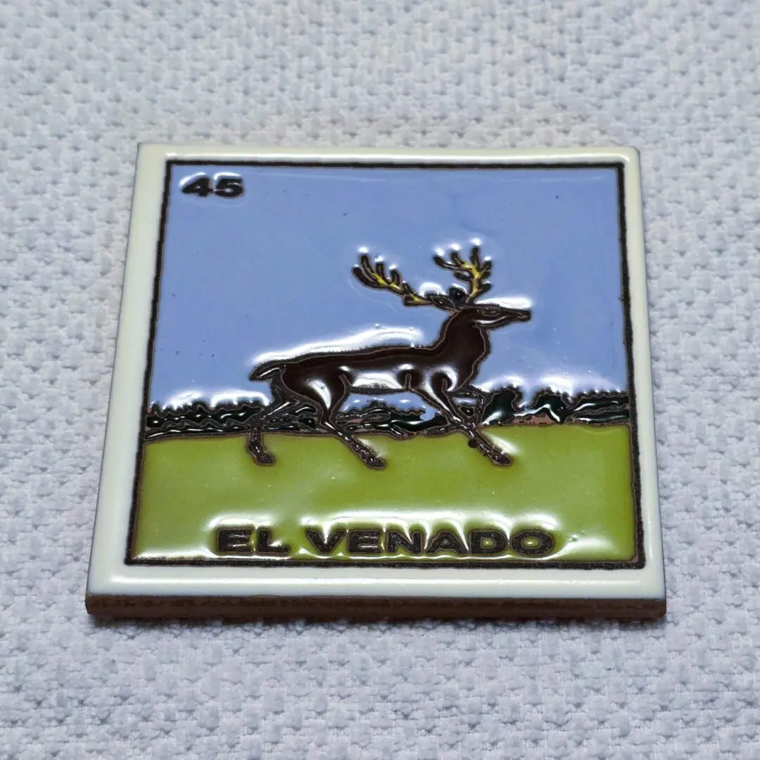 Deer on square tile with "El Venado".