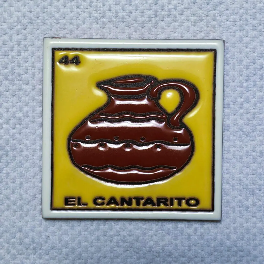 Yellow tile with brown jug illustration.