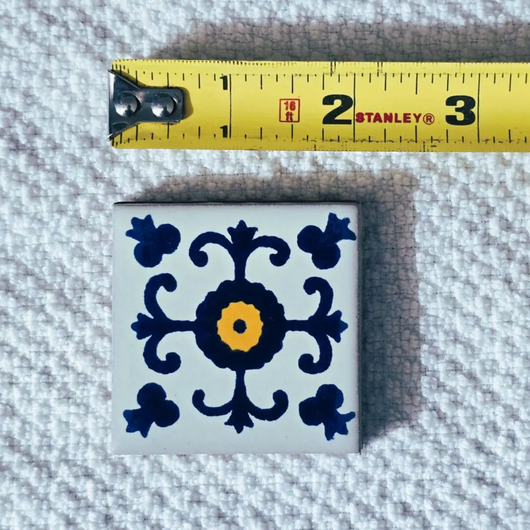 Small ceramic tile with blue floral motif